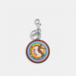 ride with pride bag charm in rainbow signature canvas