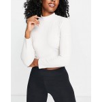 Nike Yoga Luxe Dri-FIT cropped long sleeve top in off white