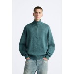 Mock neck sweater with front zip closure. Long sleeves. Rib trim.