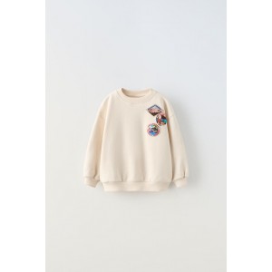 SWEATSHIRT WITH PATCHES