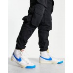 Nike Blazer Mid 77 trainers in white and blue
